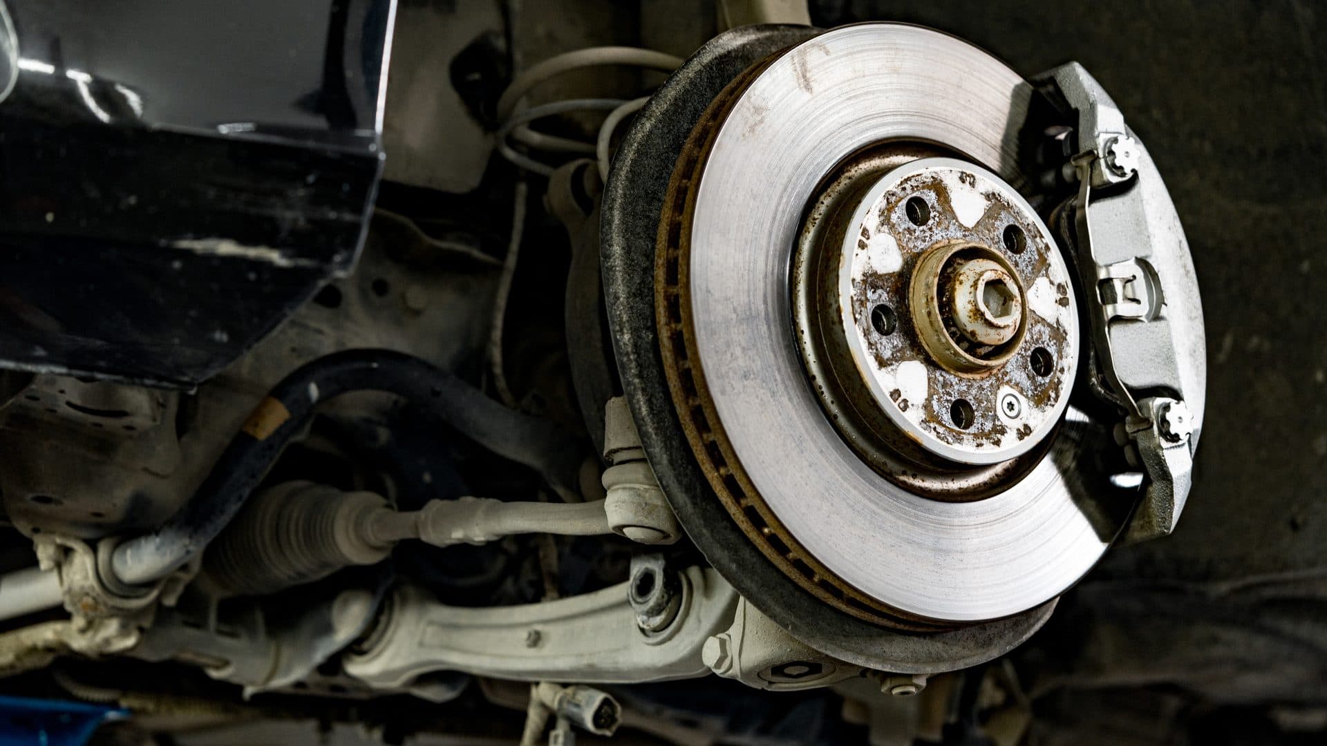 Brake pad and rotor service on a vehicle wheel