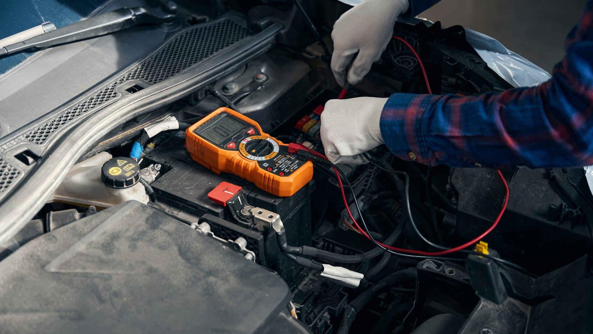 Automotive diagnostic work being performed in an engine bay